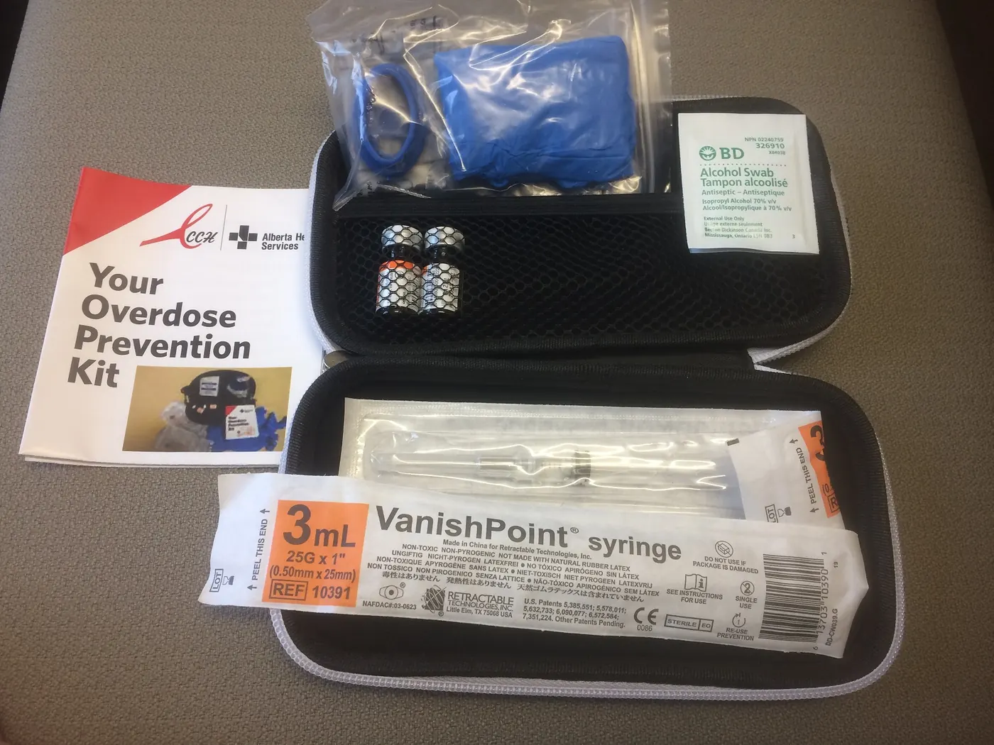 An open take-home naloxone kit